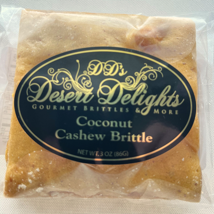 Packaged coconut cashew brittle with 'DD's Desert Delights' label on a white background