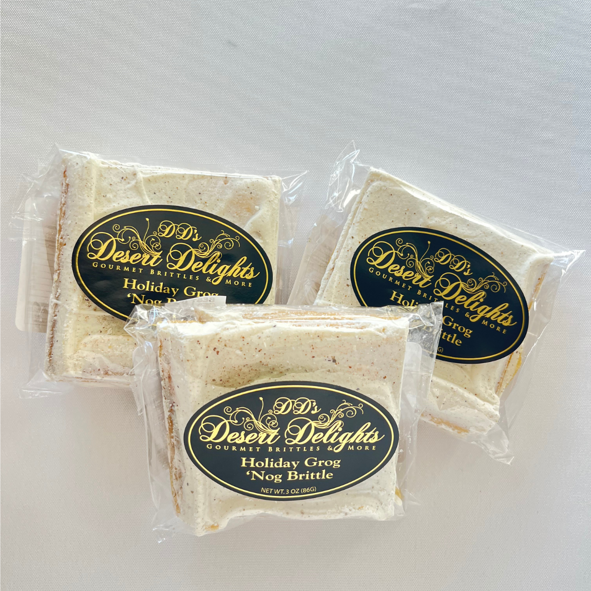 Three packages of Desert Delights holiday treats on a white background