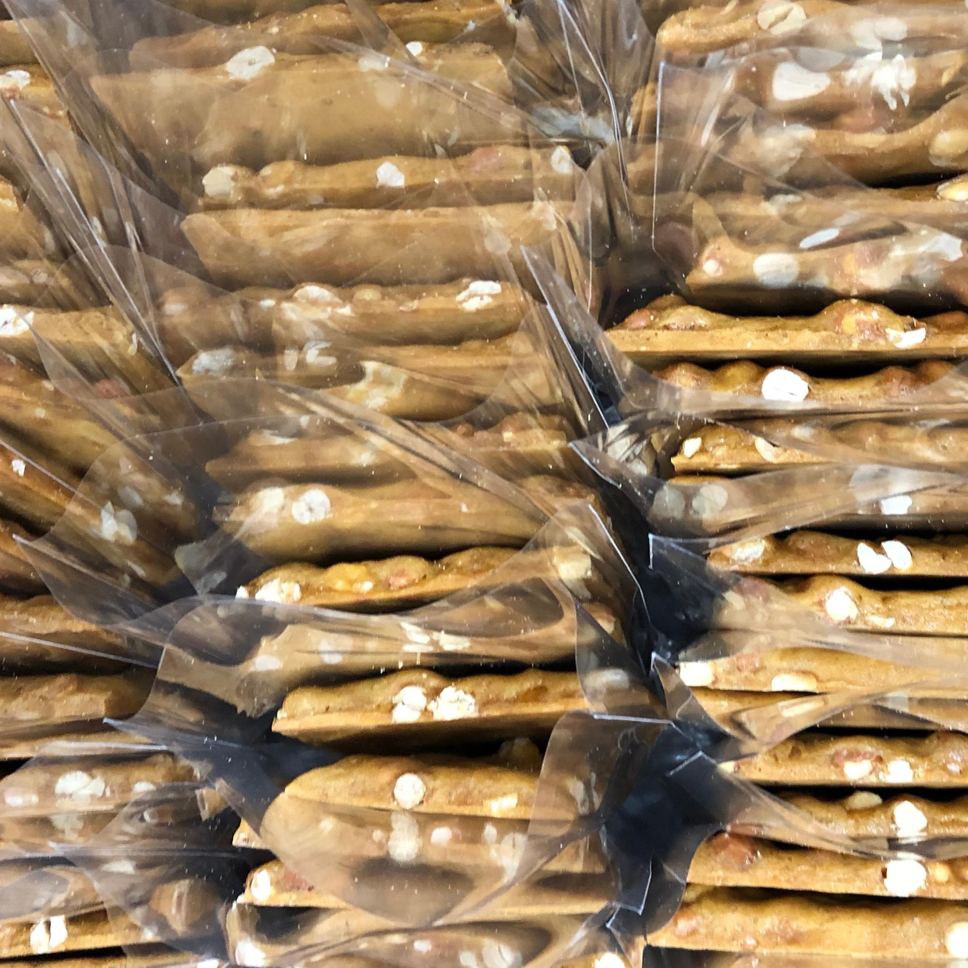 Stack of wrapped pretzel rods with clear plastic packaging.
