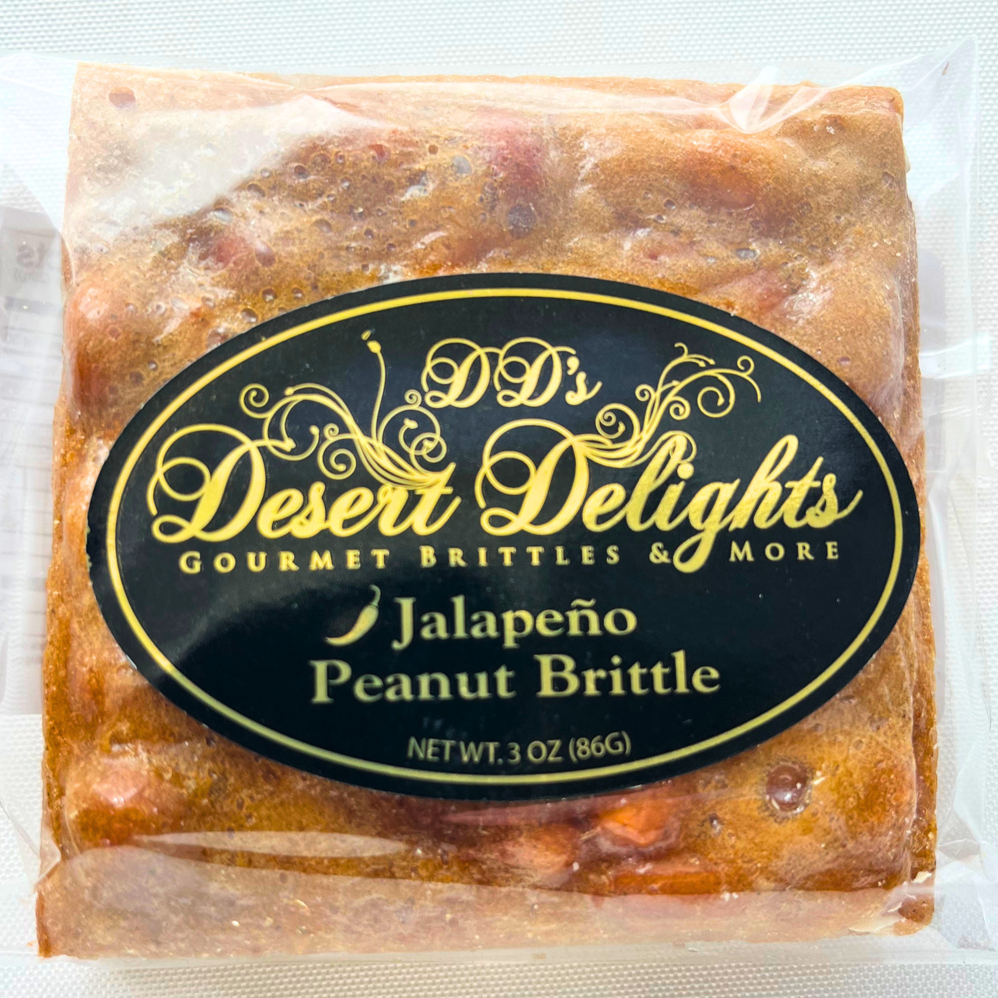 Packaged jalapeño peanut brittle with 'DD's Desert Delights' label on a white background