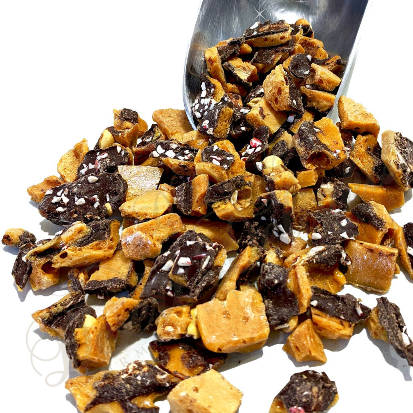 Candycane chocolate-dipped caramel peanut brittle on a white background